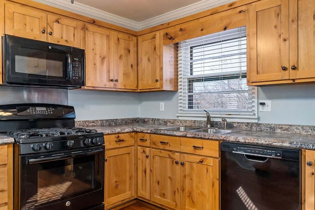 kitchen featuring dark countertops, black appliances, ornamental molding, and a sink