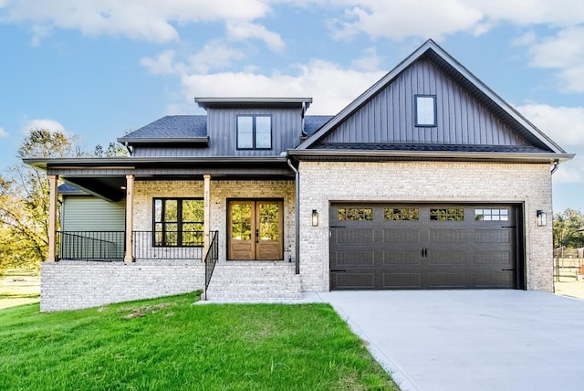 modern farmhouse featuring an attached garage, brick siding, concrete driveway, board and batten siding, and a front yard