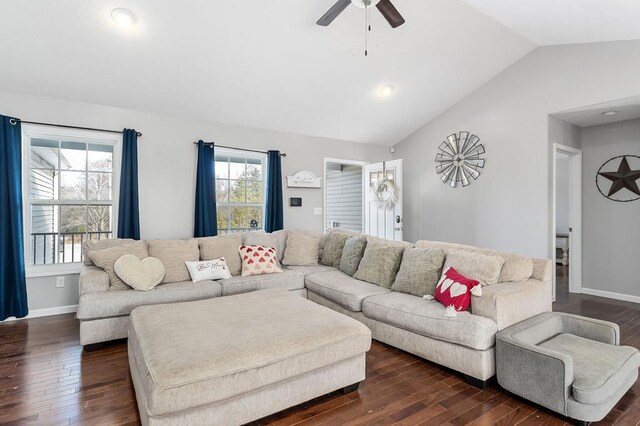 living room with vaulted ceiling, ceiling fan, dark wood-style flooring, and baseboards