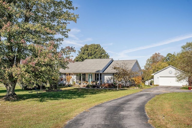 view of front of house featuring a garage and a front yard