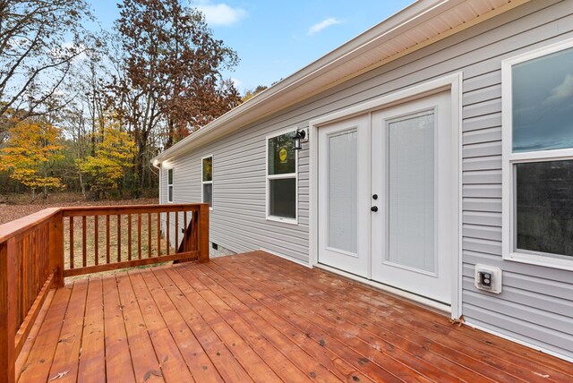 wooden deck featuring french doors