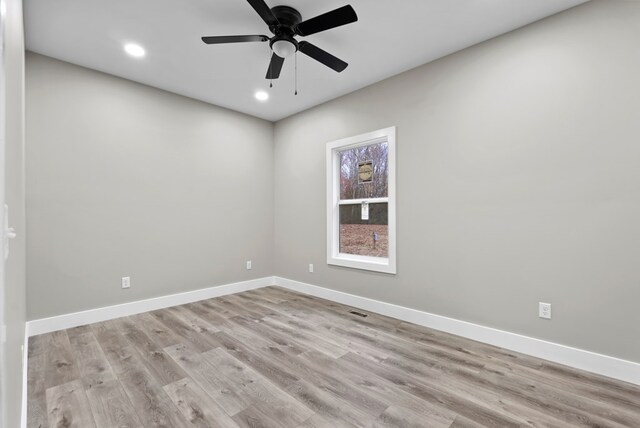 empty room with ceiling fan, recessed lighting, visible vents, baseboards, and light wood-type flooring