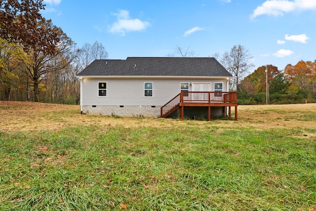 rear view of house with crawl space, stairway, a deck, and a yard