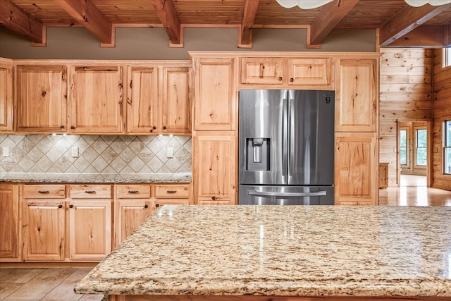 kitchen with tasteful backsplash, stainless steel fridge, and wood ceiling