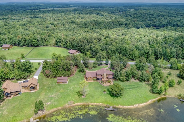 aerial view featuring a water view and a wooded view