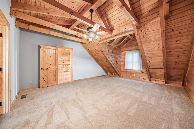 bonus room with vaulted ceiling with beams, wooden ceiling, carpet flooring, and visible vents