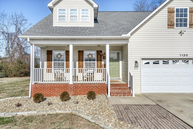 view of front facade featuring a garage, covered porch, a shingled roof, and concrete driveway