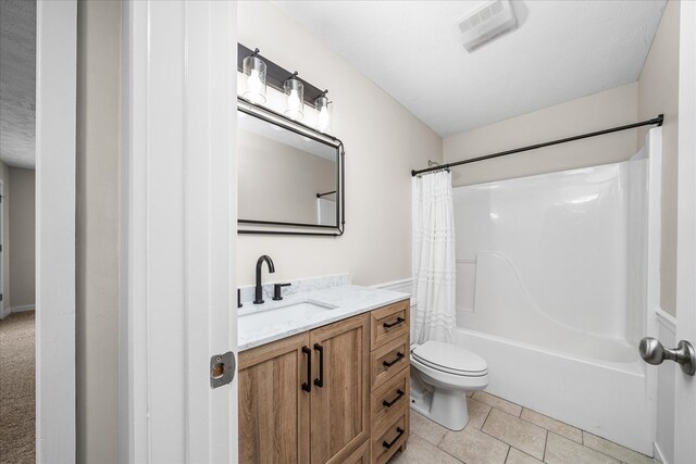 bathroom featuring visible vents, toilet, shower / bath combo with shower curtain, a textured ceiling, and vanity