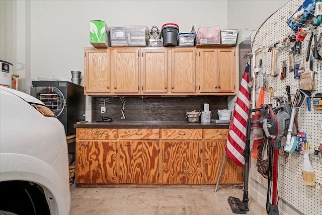 kitchen featuring concrete floors and dark countertops