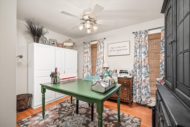 home office featuring light wood-style flooring and ceiling fan