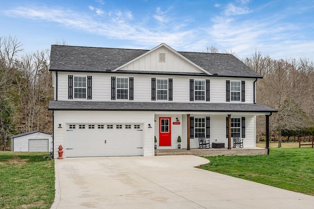 view of front of house featuring driveway, roof with shingles, an attached garage, board and batten siding, and a porch