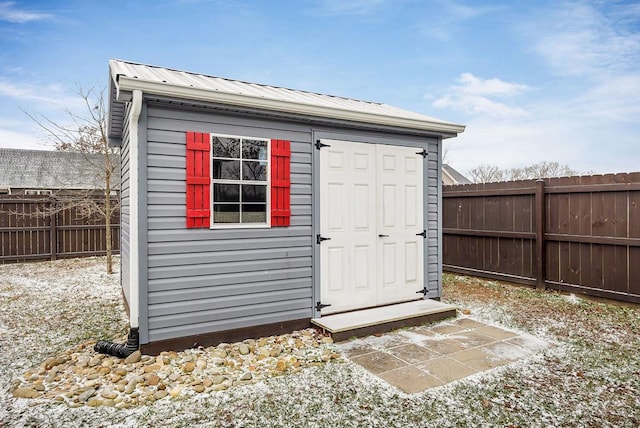 view of shed featuring a fenced backyard