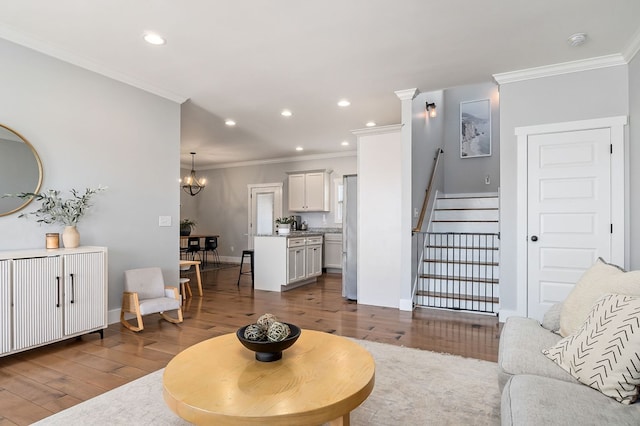 living room featuring stairs, ornamental molding, dark wood-style flooring, and recessed lighting