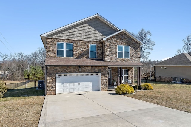 craftsman-style house with central AC unit, an attached garage, fence, driveway, and a front yard