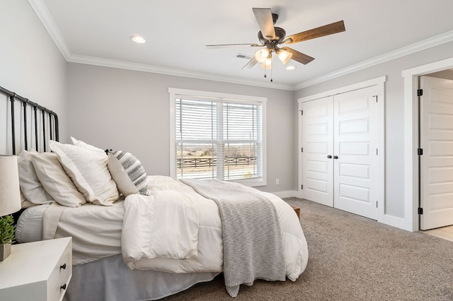 bedroom featuring light carpet, baseboards, ceiling fan, crown molding, and a closet