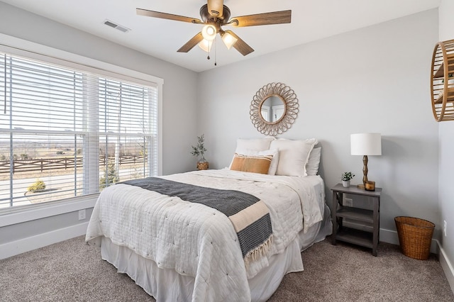 bedroom with a ceiling fan, carpet, visible vents, and baseboards