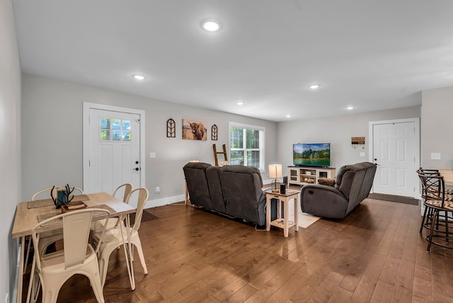 living area featuring dark wood-style floors, baseboards, and recessed lighting