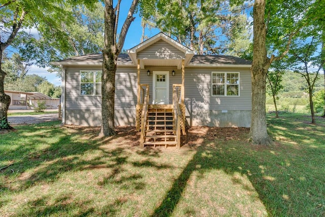 view of front of house with a front lawn and crawl space