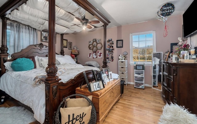 bedroom featuring a ceiling fan and light wood-type flooring