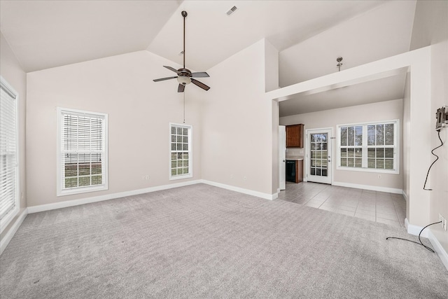 unfurnished living room featuring visible vents, baseboards, carpet, high vaulted ceiling, and a ceiling fan