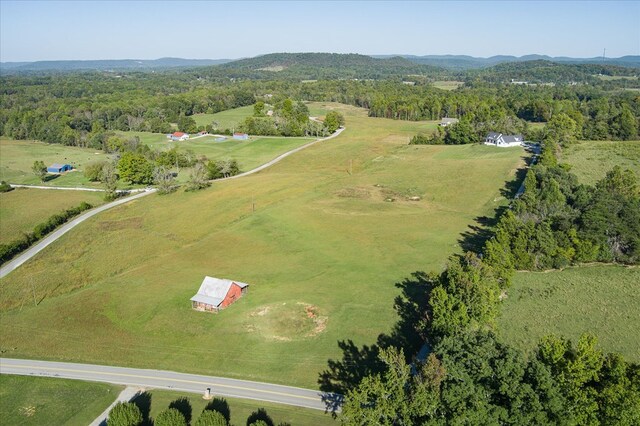 bird's eye view featuring a rural view and a view of trees