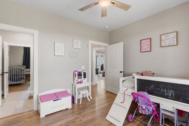 bedroom with ceiling fan and wood finished floors