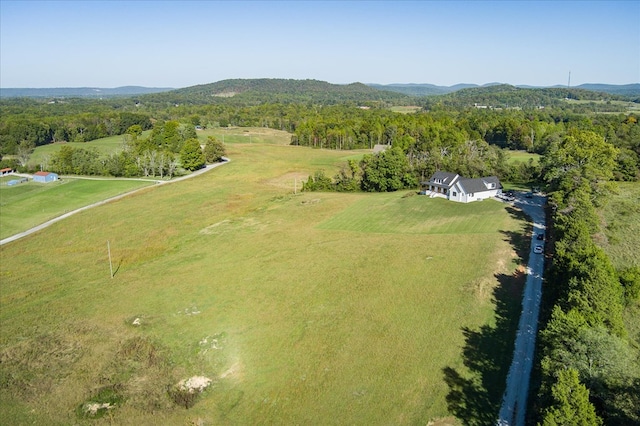 aerial view featuring a rural view and a view of trees