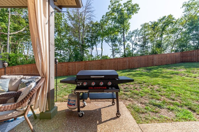 view of yard featuring a patio area and a fenced backyard