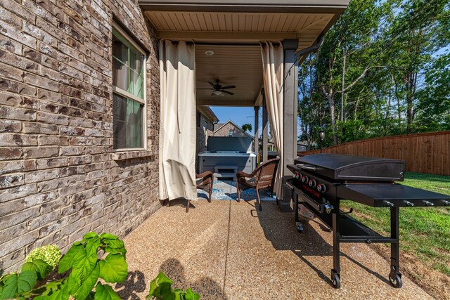 view of patio / terrace with fence and ceiling fan