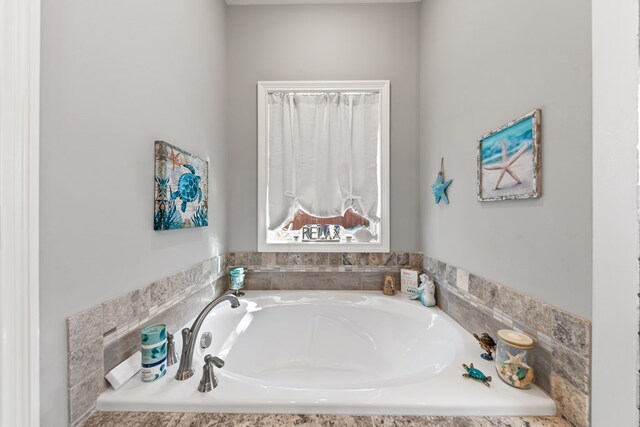 bathroom with a garden tub