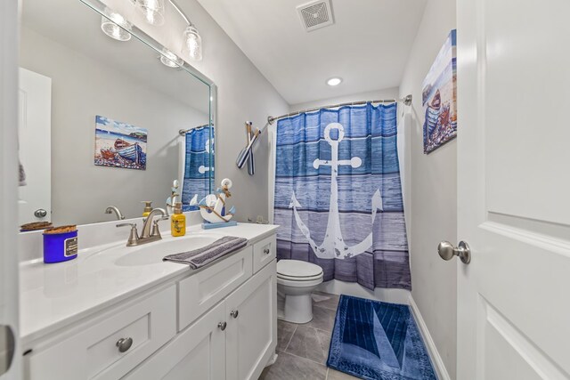 bathroom featuring toilet, visible vents, vanity, a shower with curtain, and tile patterned floors