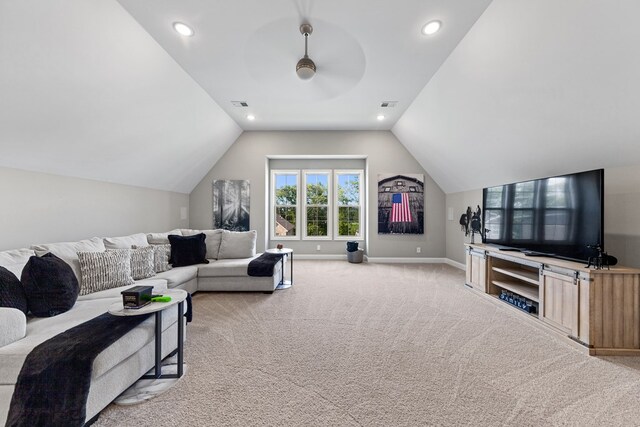 living area featuring light carpet, baseboards, visible vents, and lofted ceiling