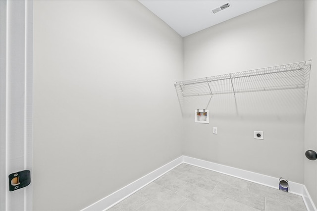 laundry area with electric dryer hookup, visible vents, baseboards, hookup for a washing machine, and laundry area