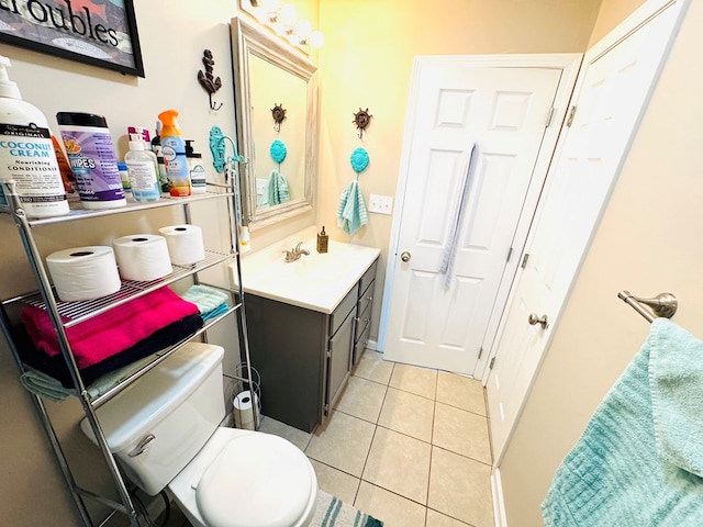 bathroom featuring vanity, toilet, and tile patterned floors