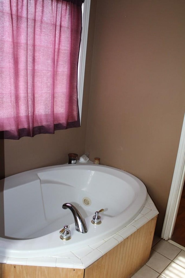 full bath with a tub and tile patterned flooring