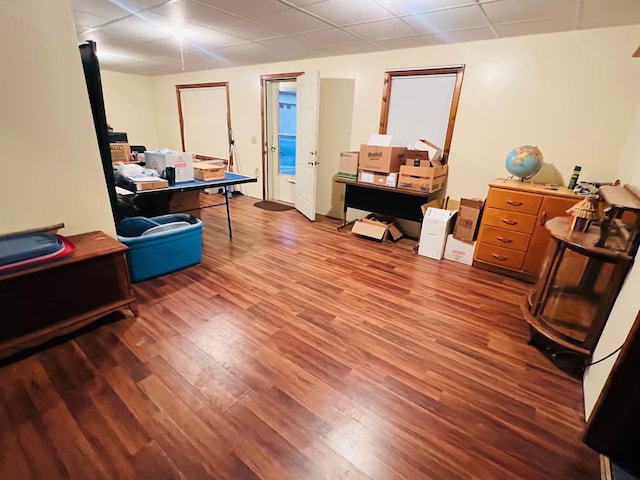 office area with a drop ceiling and wood finished floors