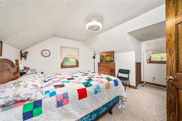 bedroom featuring a textured ceiling, vaulted ceiling, light carpet, and baseboards