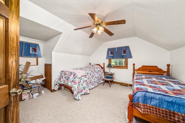 carpeted bedroom featuring lofted ceiling, a ceiling fan, and a textured ceiling