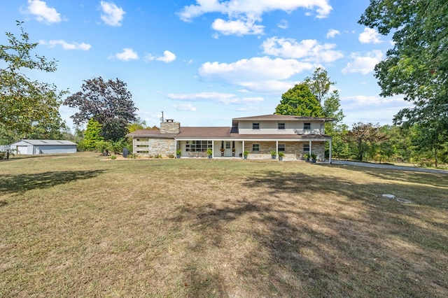 view of front of house with stone siding and a front lawn