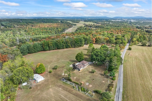 drone / aerial view featuring a forest view and a rural view