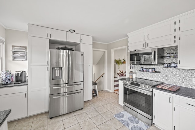 kitchen with stainless steel appliances, tasteful backsplash, white cabinetry, and crown molding