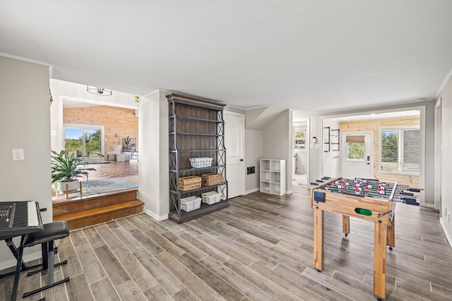 playroom with baseboards and wood finished floors