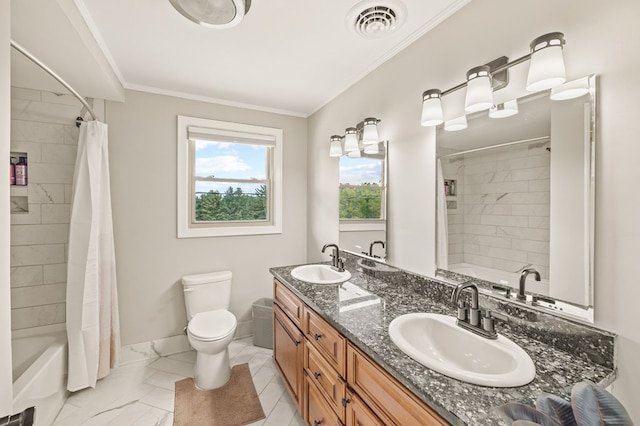 full bath featuring double vanity, ornamental molding, a sink, and visible vents