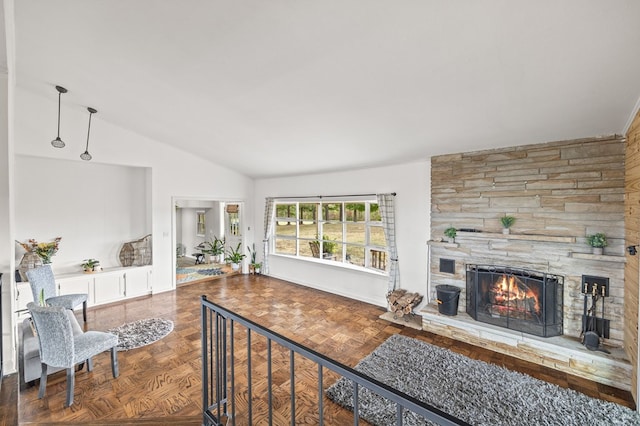 living area with lofted ceiling, a fireplace, and visible vents