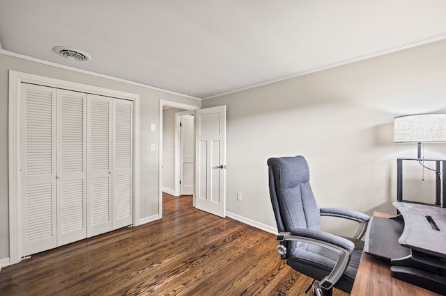 home office featuring dark wood-type flooring, visible vents, crown molding, and baseboards