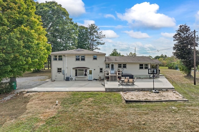 back of property featuring a patio area and a yard