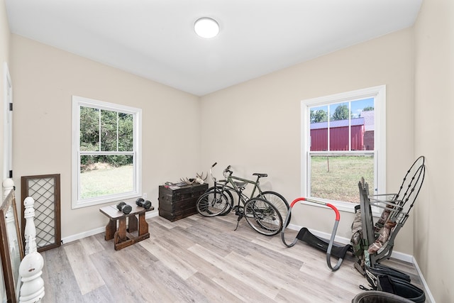 misc room featuring light wood finished floors and baseboards