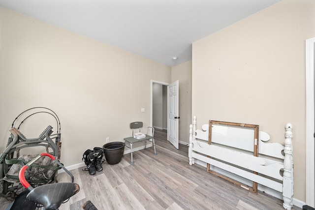 misc room with light wood-style flooring and baseboards