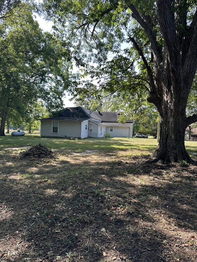 view of yard featuring an attached garage