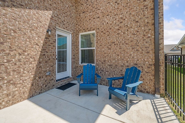 view of patio / terrace featuring fence